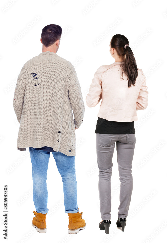 Fototapeta premium Back view of couple. beautiful friendly girl and guy together.