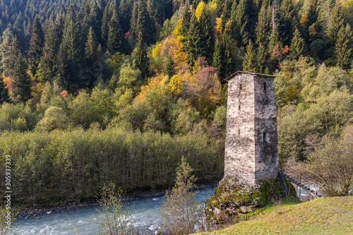 The remains  of a watch tower lonely standing on the Patara Enguri river bank at the foot of the mountains - Koshki - called the Tower of Love in Svaneti in the mountainous part of Georgia photo