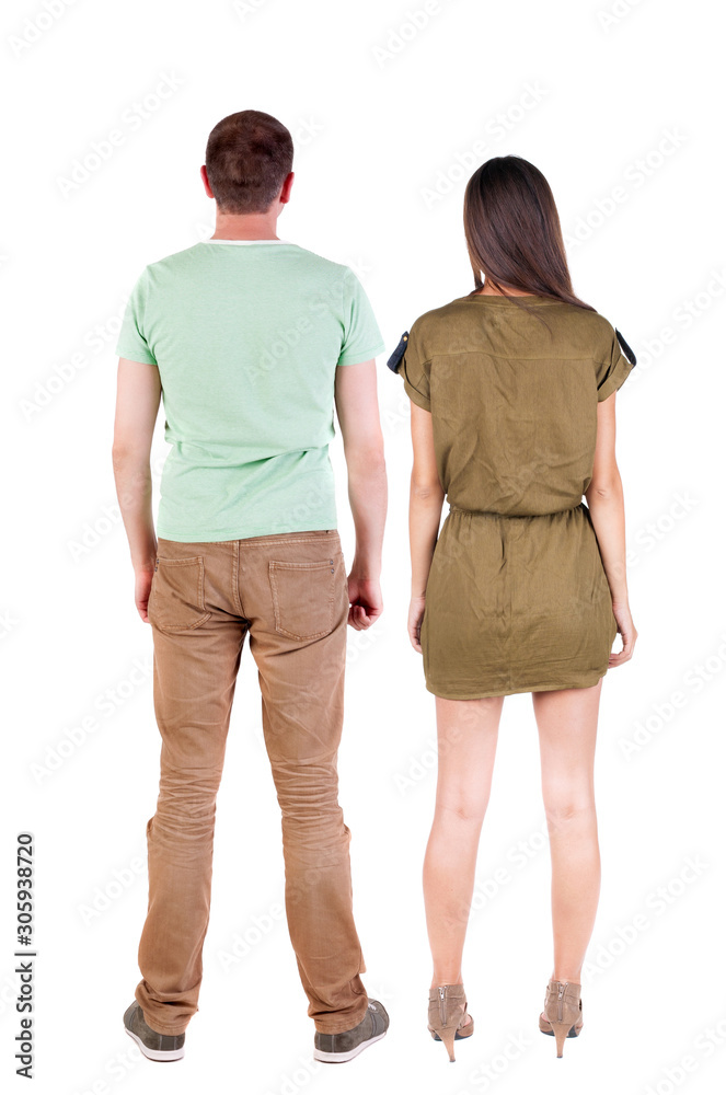 Back view of couple. beautiful friendly girl and guy together. Back view of couple. beautiful friendly girl and guy together.