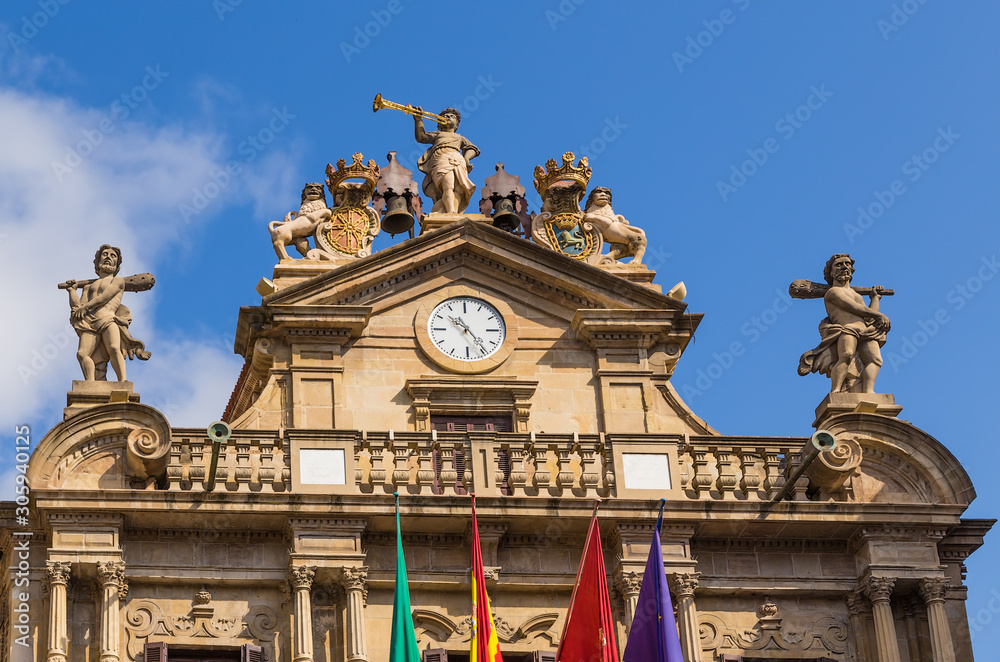 Pamplona, Spain. The pediment of the facade of City Hall with a clock and statues, XVIII century.