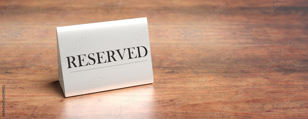 Reserved table tent on a wooden table, copy space. 3d illustration Reserved table tent on a wooden table, copy space. 3d illustration