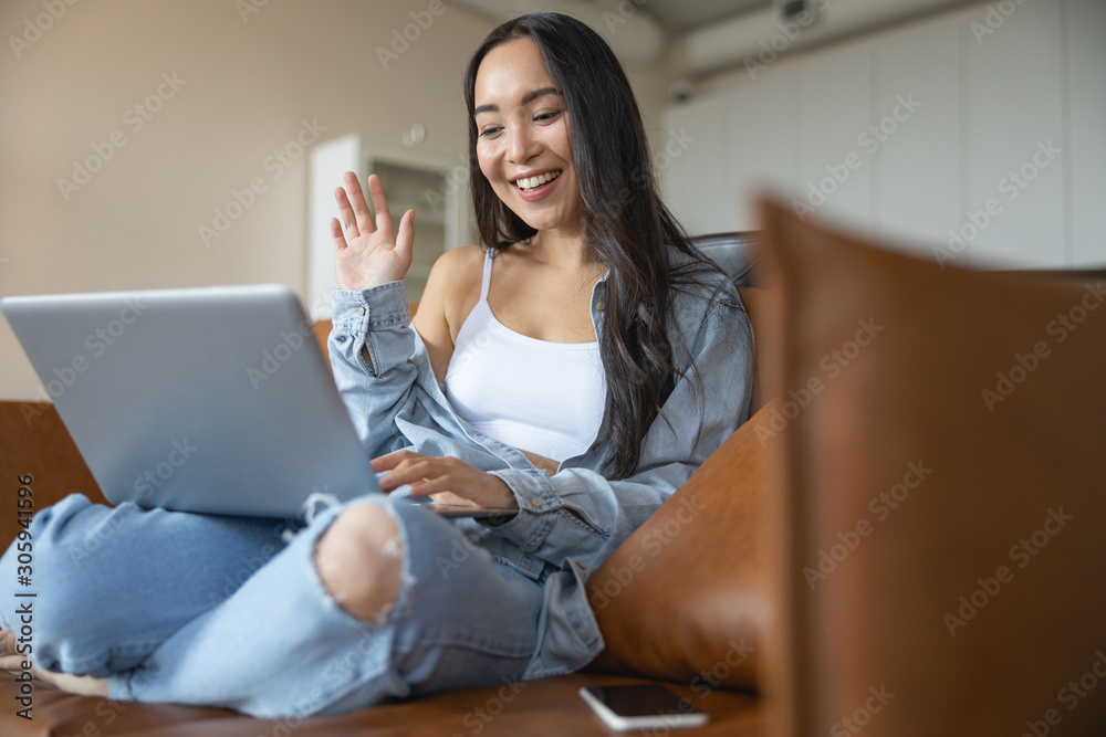 Female using the internet on her laptop