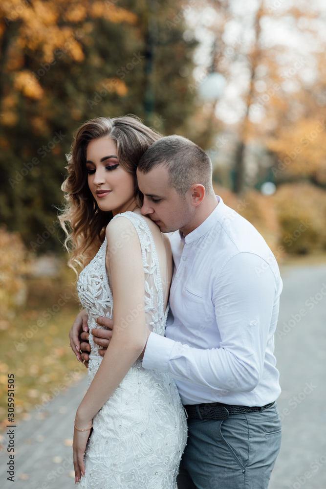 Autumn walk. Autumn love story of a young couple. Young people love each other. Young happy couple on a walk in the park. Love relationship. Autumn walk. Autumn love story of a young couple. Young people love each other. Young happy couple on a walk in the park. Love relationship.