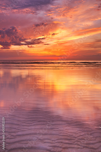 Sunset reflections on the beach  Texel island  The Netherlands