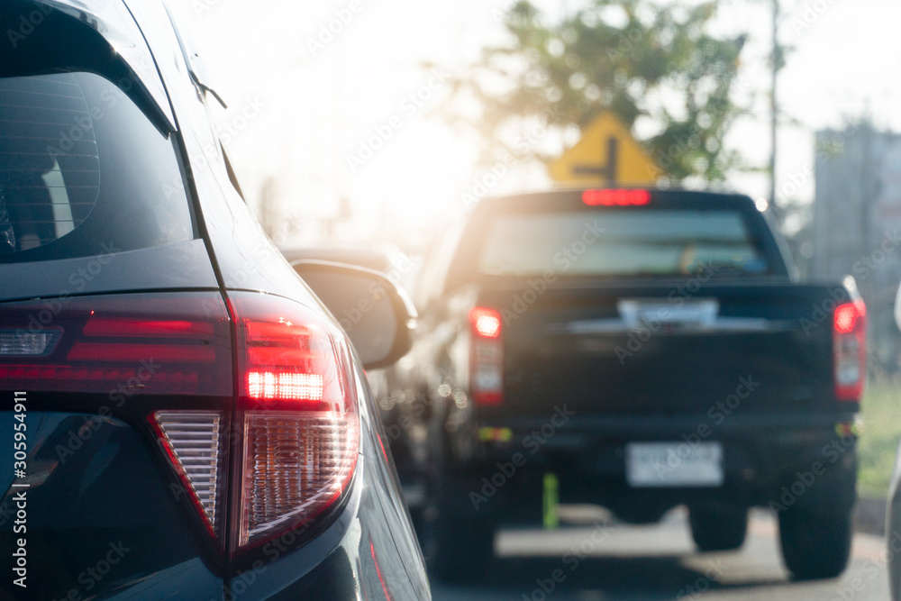 Luxury of black car open brake light on the road with blurred other cars in the city. and stop by traffic jam. Luxury of black car open brake light on the road with blurred other cars in the city. and stop by traffic jam.