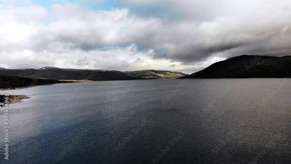 4k aerial: panning towards a big glacier-lake dam in norway 4k aerial: panning towards a big glacier-lake dam in norway