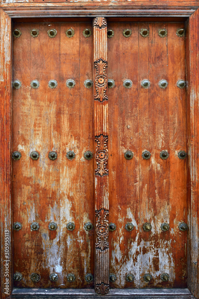 Traditional wooden carved door in Stone Town, Zanzibar, Tanzania, Africa Traditional wooden carved door in Stone Town, Zanzibar, Tanzania, Africa