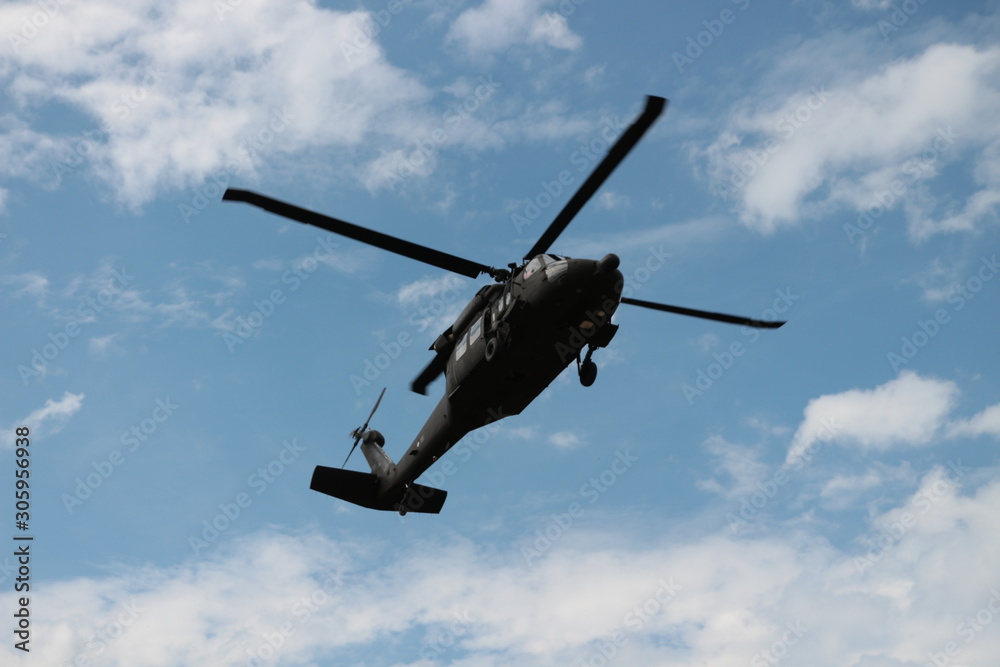 Fototapeta premium Helicopter fly in the sky.