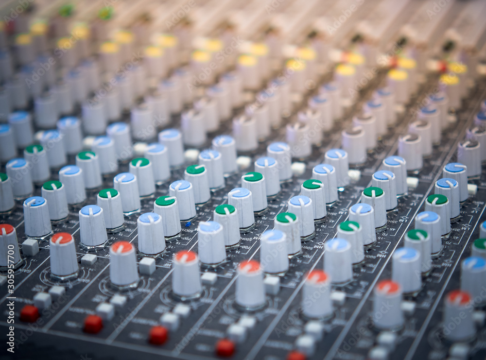 Sound equalizer mixing. Professional studio equipment for sound mixing. Music studio image. Close up and selective focus. Sound equalizer mixing. Professional studio equipment for sound mixing. Music studio image. Close up and selective focus.