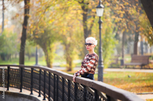 stylish woman in autumn park