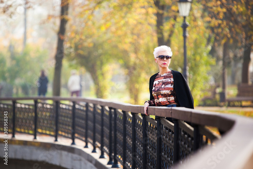 stylish woman in autumn park
