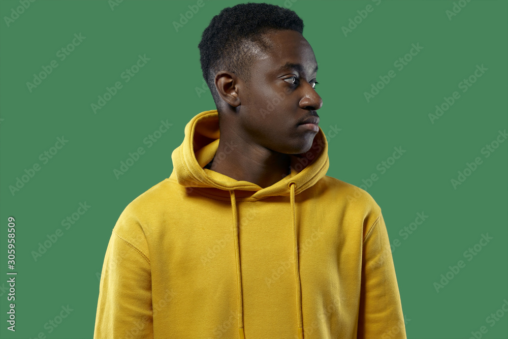 young black man in yellow hoodie young black man in yellow hoodie