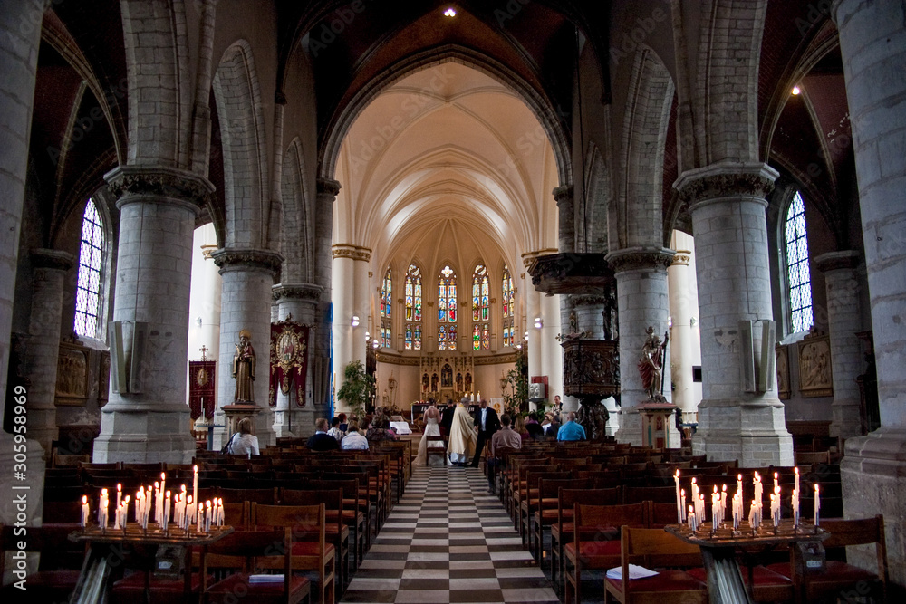 Large European Belgian Church Interior with chairs and altar and tabernacle 