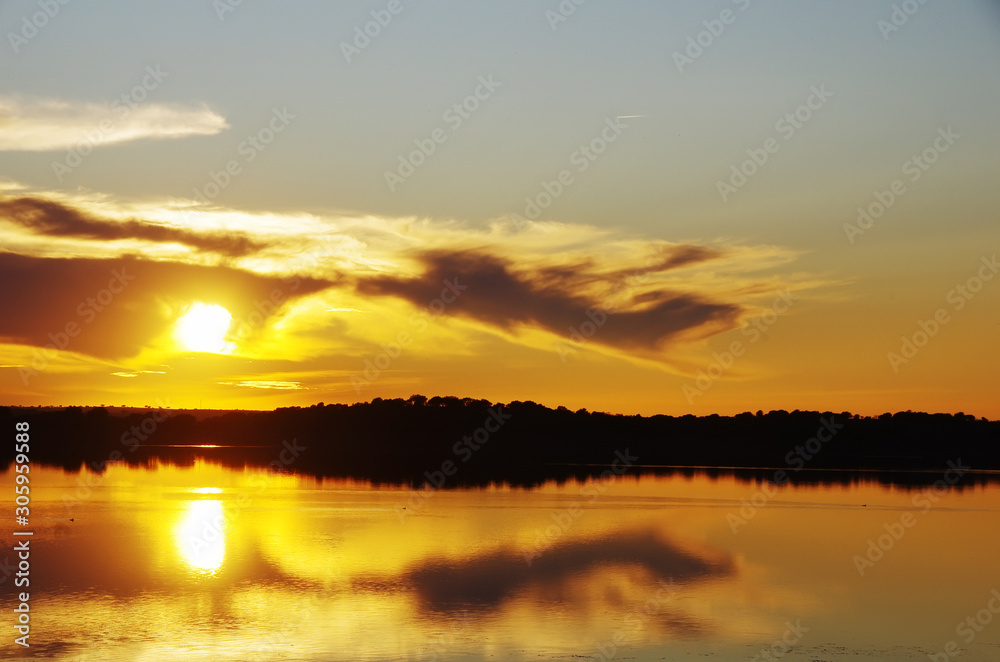 sunset landscape in alqueva lake, portugal