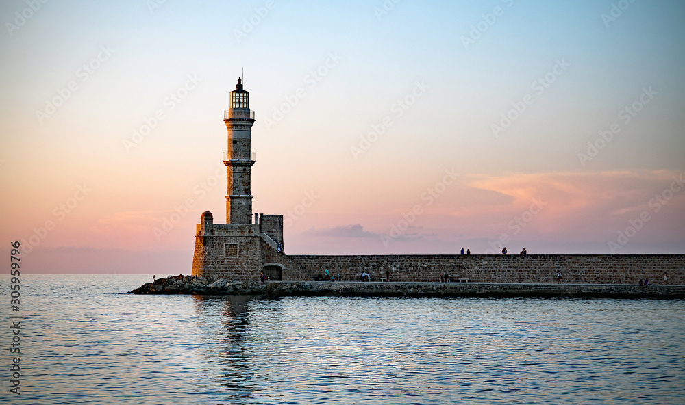 Lighthouse at harbour of Chania at sunset, Crete