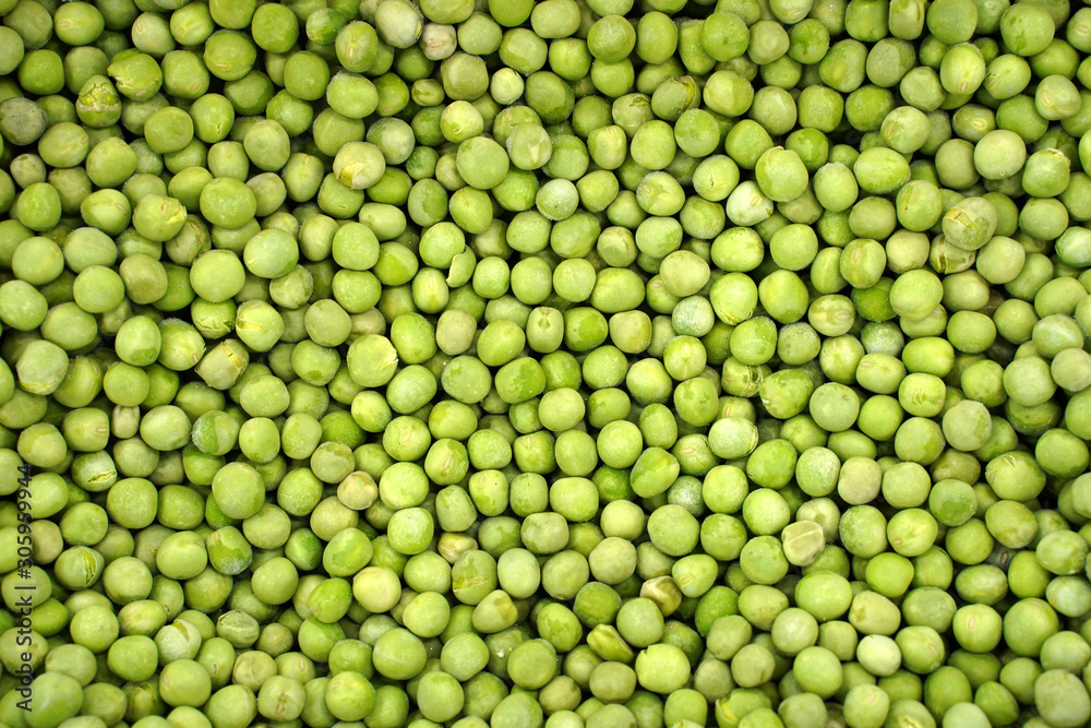background of frozen green peas background of frozen green peas