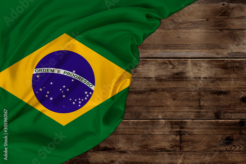 color national flag of modern state of Brazil, beautiful silk, background old wood, concept of tourism, economy, politics, emigration, independence day, copy space, template, horizontal