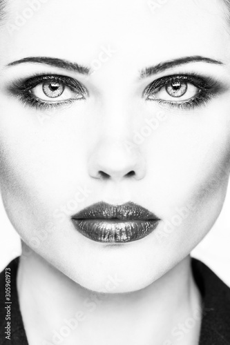 Black-white portrait of beautiful young girl. Fashionable woman
