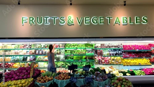 business woman on background shopping food market. Young adult female mother day in store. concept attractive happy healthy and beautiful customer in shop. fruit and health green vegetable, 4k