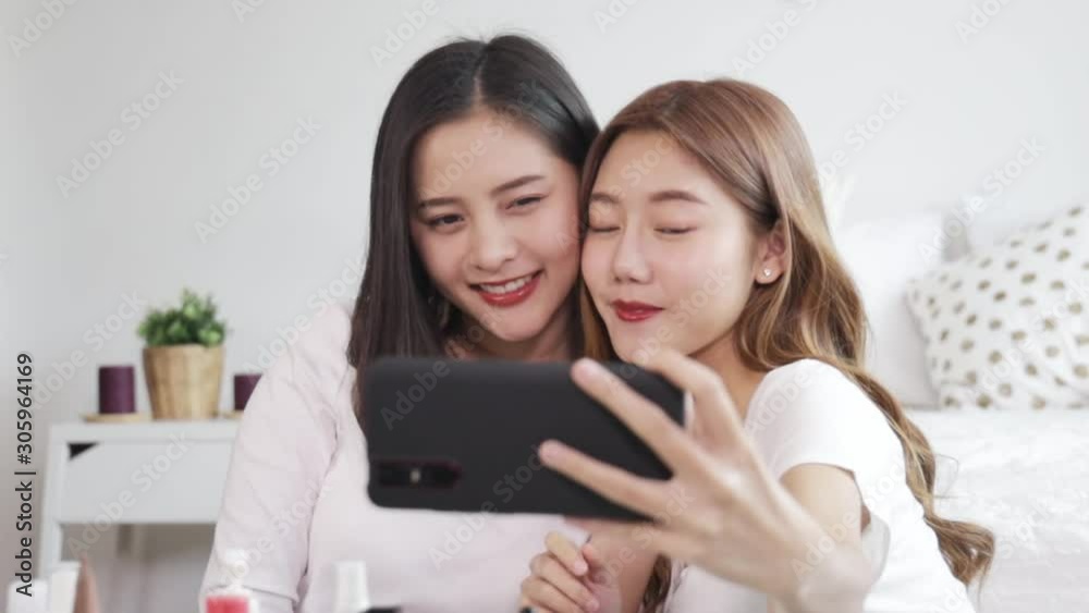 Portrait of young asian woman review giveaway gift product fan following channel, recording video make up lipstic cosmetic at home. Beauty blogger present beauty cosmetics Portrait of young asian woman review giveaway gift product fan following channel, recording video make up lipstic cosmetic at home. Beauty blogger present beauty cosmetics