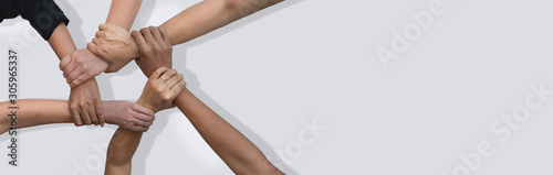 Business people united hands together in teamwork on white background with copy space for header.