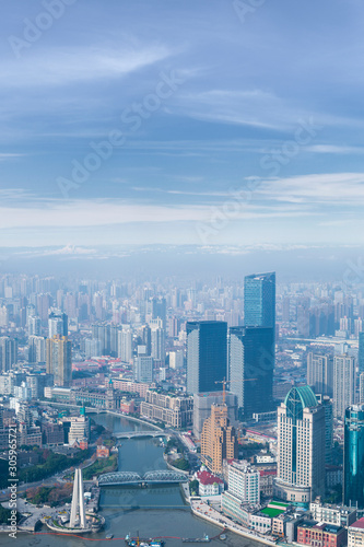aerial view of Shanghai city skyline and modern skyscraper and Historical architecture on the bund of Shanghai in misty sky pollution haze, in Shanghai, China.