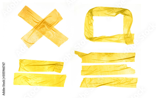 Set of yellow tapes on white background. Torn horizontal and different size yellow sticky tape, adhesive pieces. photo