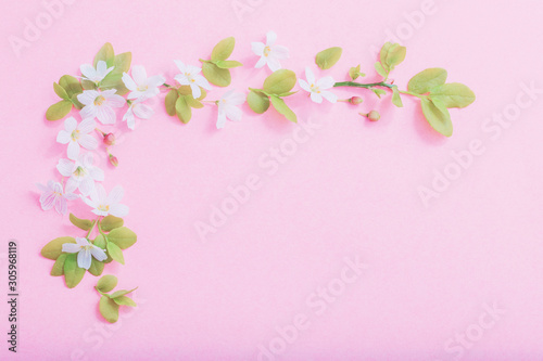 white flowers on pink paper background