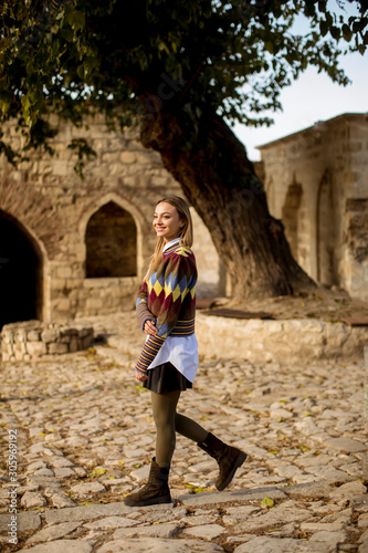 Pretty young woman walking ...