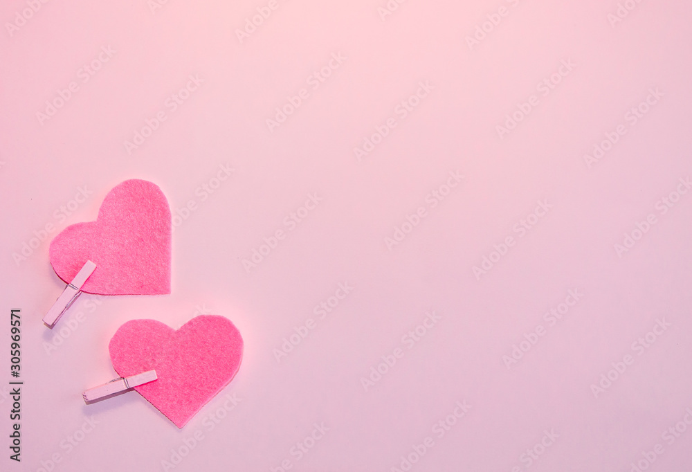 Pink felt hearts on a pink background. Happy Valentine. Flat lay.
