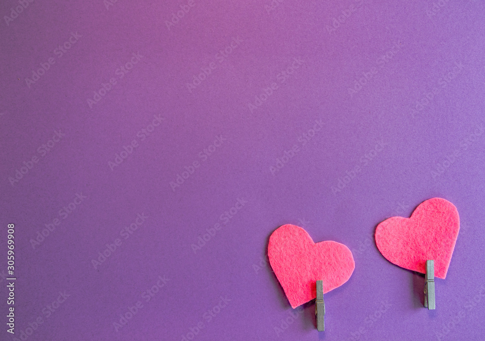 Pink felt hearts on a purple background. Flat lay. Happy Valentine. Pink felt hearts on a purple background. Flat lay. Happy Valentine.