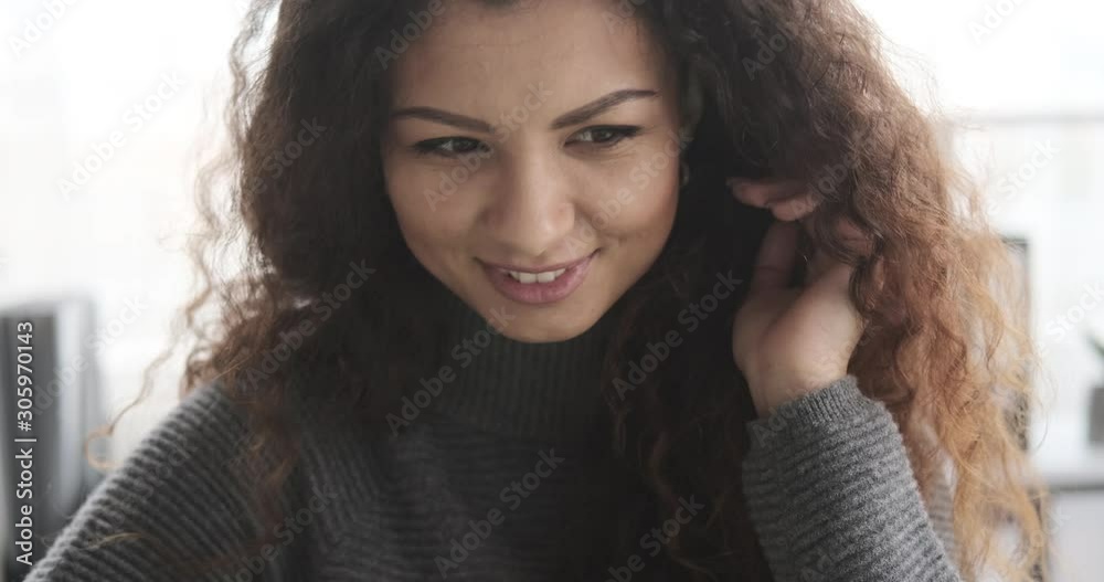 Focused smiling young woman working at office Focused smiling young woman working at office