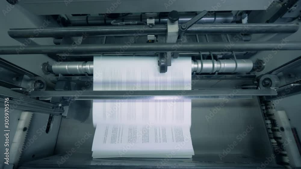 Printed paper stacked on a typography line, automated machine. Printed paper stacked on a typography line, automated machine.