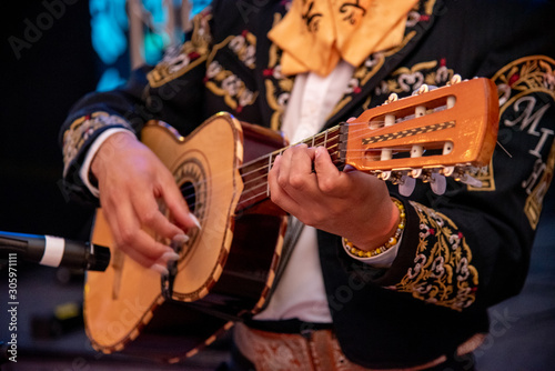 mariachi tocando musica mexicana en fiesta mexicana  photo