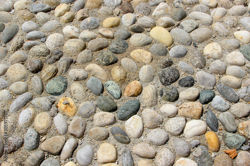 Φωτογραφία An old pebblestone road cobbled with natural stones