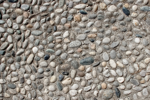 Fényképezés An old pebblestone road cobbled with natural stones