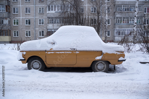 Car ZAZ covered with snow