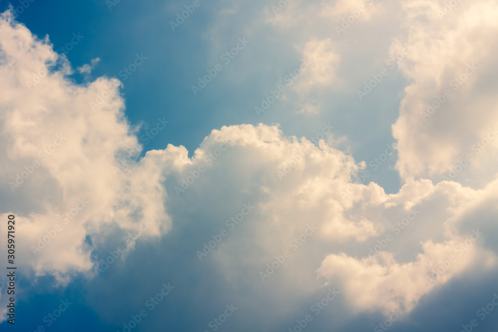 white Cumulus clouds on a blue sky