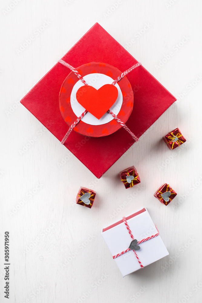 Present red gift box with red paper heart Present red gift box with red paper heart