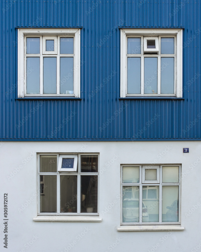 Minimalist architecture wall with windows design flaw, not alligned mind boggling