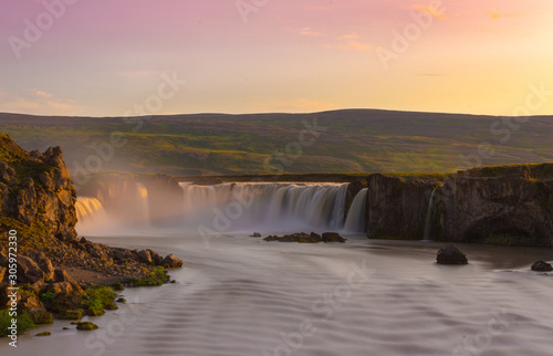 Sunset  colorful dawn over river with big waterfall  Godafoss Iceland