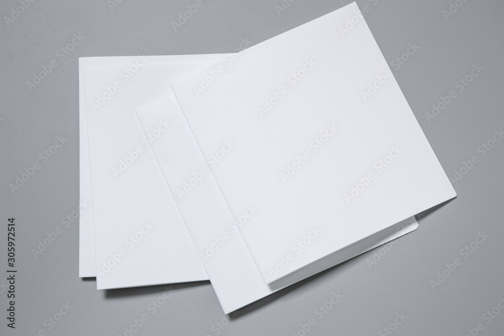 Blank portrait mock-up paper. brochure magazine isolated on gray, changeable background / white paper isolated on gray Blank portrait mock-up paper. brochure magazine isolated on gray, changeable background / white paper isolated on gray