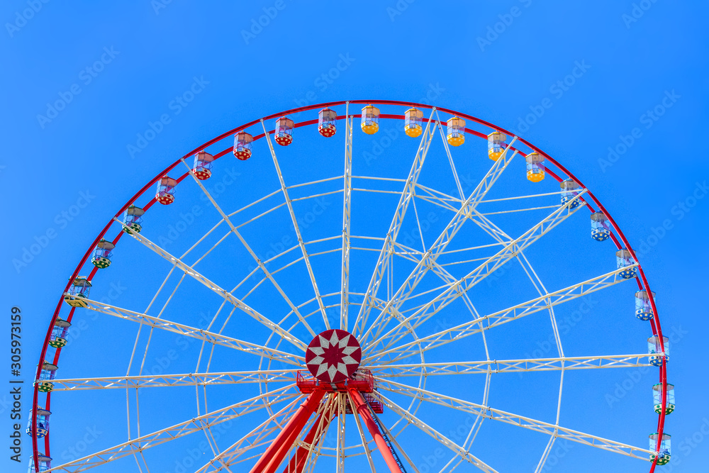 Big ferris wheel against the blue sky Big ferris wheel against the blue sky