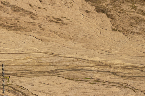 texture of sand, detail of sand dunes in desert and small creeks 