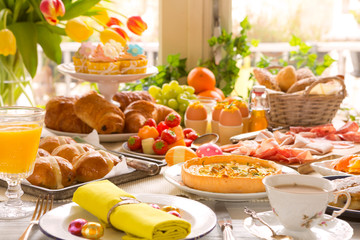 Table with delicatessen ready for Easter brunch