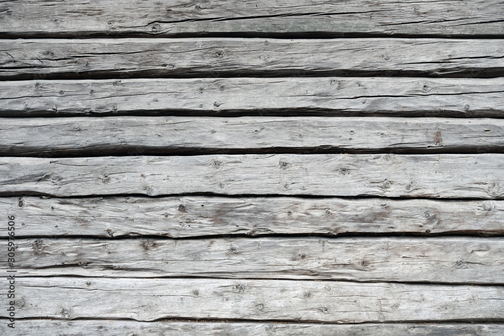 gray weathered wooden wall from logs