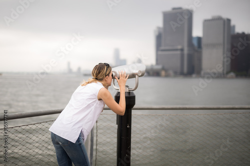 A woman looking out over a city