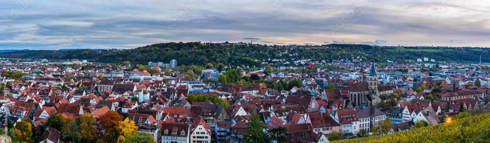 Germany, XXL panorama view over houses, st dionysius church, roofs and skyline of medieval city esslingen am neckar at sunset in colorful autumn mood