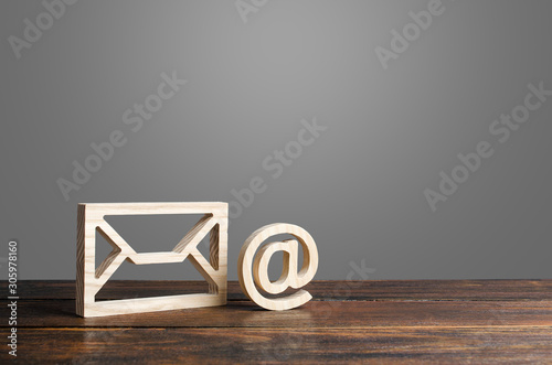 Email symbol at commercial and envelope. internet correspondence. Contacts for business. Internet and global communication technologies, digitalization of economy and processes.