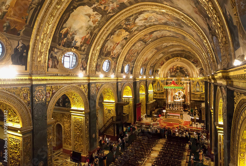 Beautiful interior of the 16th century St John's Co-Cathedral, with frescoes inside Roman Catholic church. Valletta, Malta. photo